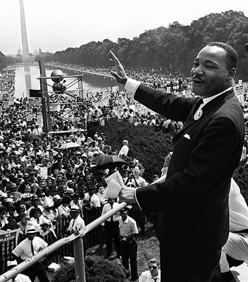 The civil rights leader Martin Luther KIng (C) waves to supporters 28 August 1963 on the Mall in Washington DC (Washington Monument in background) during the "March on Washington". King said the march was "the greatest demonstration of freedom in the history of the United States." Martin Luther King was assassinated on 04 April 1968 in Memphis, Tennessee. James Earl Ray confessed to shooting King and was sentenced to 99 years in prison. King's killing sent shock waves through American society at the time, and is still regarded as a landmark event in recent US history. AFP PHOTO (Photo credit should read -/AFP/Getty Images)